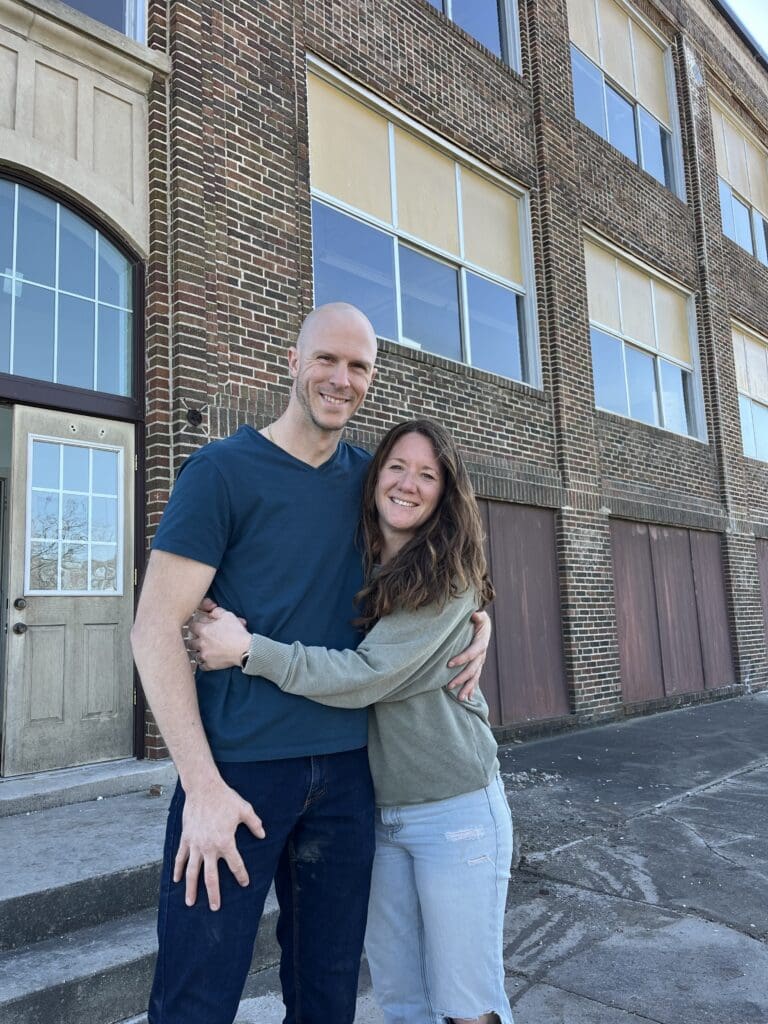 Brad and Lori standing infront of the Washing Township School in Miburn Iowa.