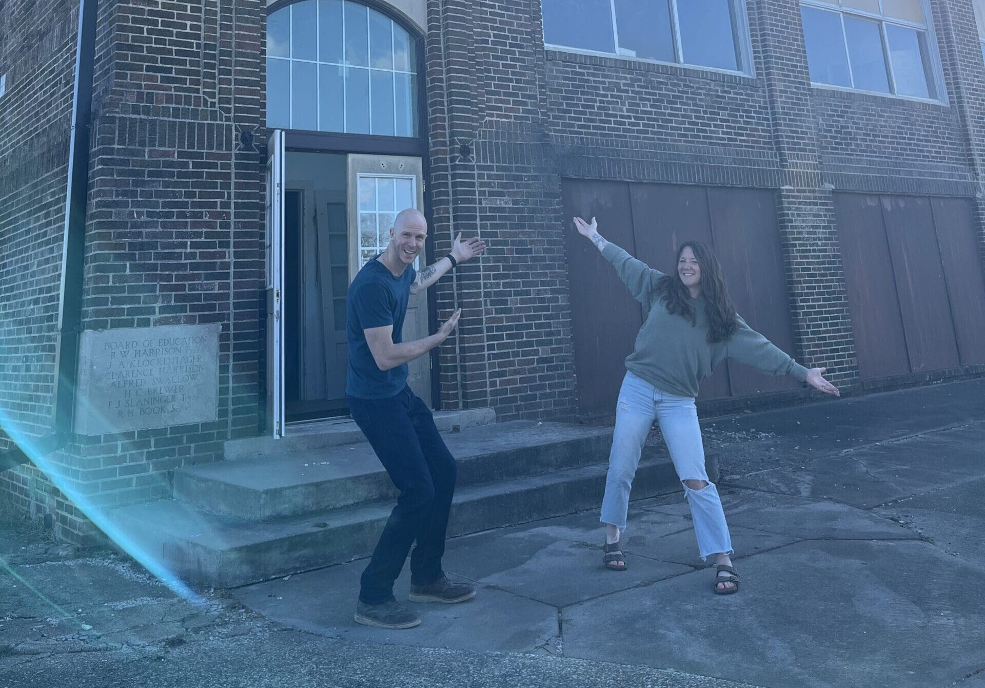 Brad and Lori standing infront of the Washing Township School in Miburn Iowa.